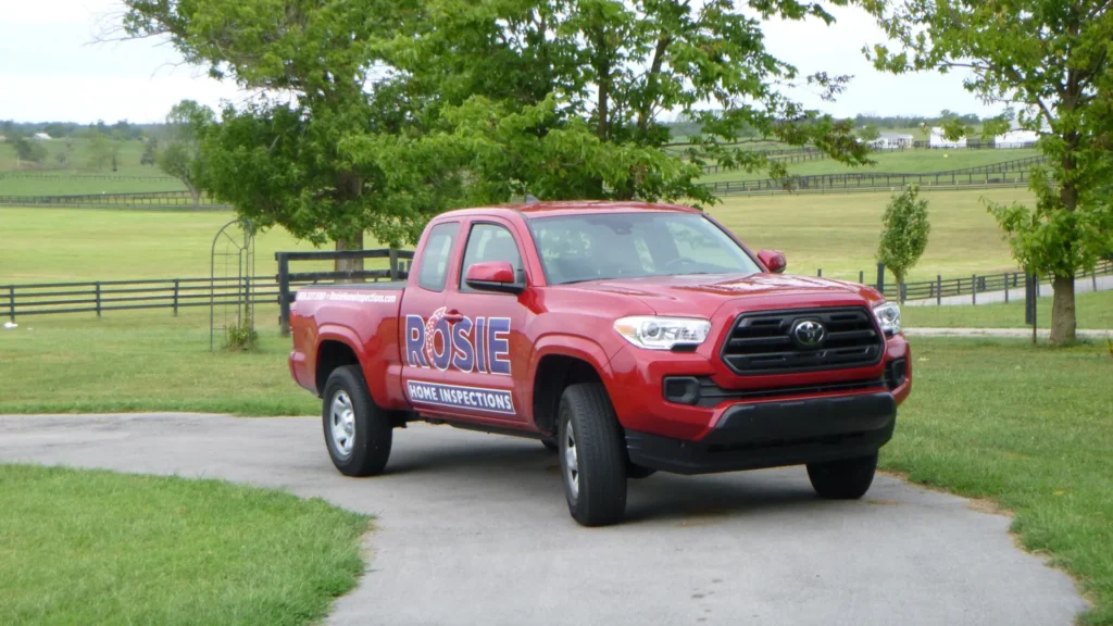Rosie Home Inspections company truck parked in a driveway